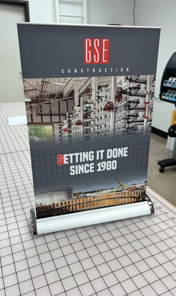 Retractable banner stand with printed graphics